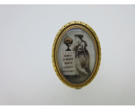 the oval plaque depicting a young woman in classical drapes leaning against a plinth on top of which is a bas relief and gold