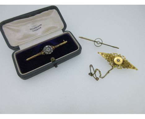 the first with an early 19th century diamond flowerhead centre, with rose cut diamonds in a reeded closed back setting, to tr