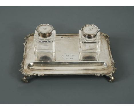 by Mappin &amp; Webb, London 1913, the shaped rectangular base with scrollwork corners and raised on four scrolled feet, with