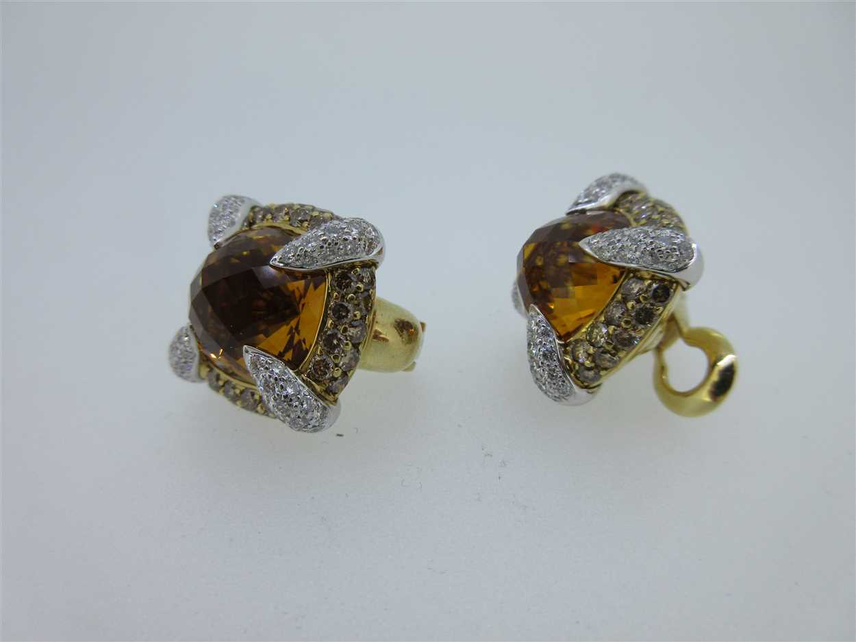 Rodney Rayner - A pair of 18ct gold diamond and citrine set earclips ...