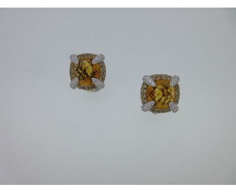 each designed as a cushion shaped harlequin cut golden citrine in a cushion border pavé set with fancy colour light cognac di