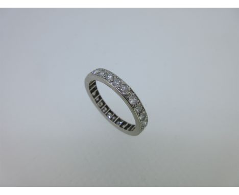 bead set with twenty-seven round brilliant cut diamonds in unmarked white metal, tests for platinum, ring size R