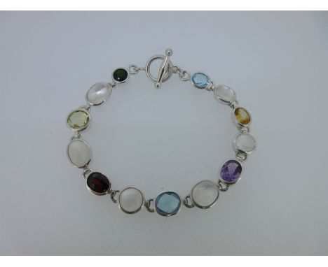 designed as a chain of collet set oval and round cabochon moonstones alternating with oval and round cut coloured gemstones, 