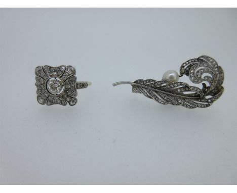 both early 20th century, the realistically modelled, pierced curled feather set throughout with rose cut diamonds, and holdin