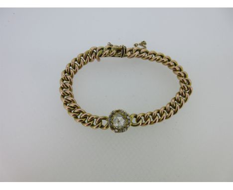 the centrepiece, adapted from a ring, has a central 6.4mm diameter rose cut diamond in a border of similar smaller diamonds (