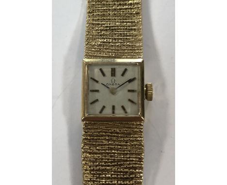 circa 1978, model 711.5694, the signed square silvered dial with gold coloured baton markers and hands, the signed 17 jewel m