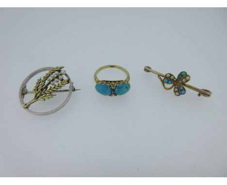 the first a ring set with two opposing oval cabochon turquoises separated by a line of four rose cut diamonds, carved shoulde