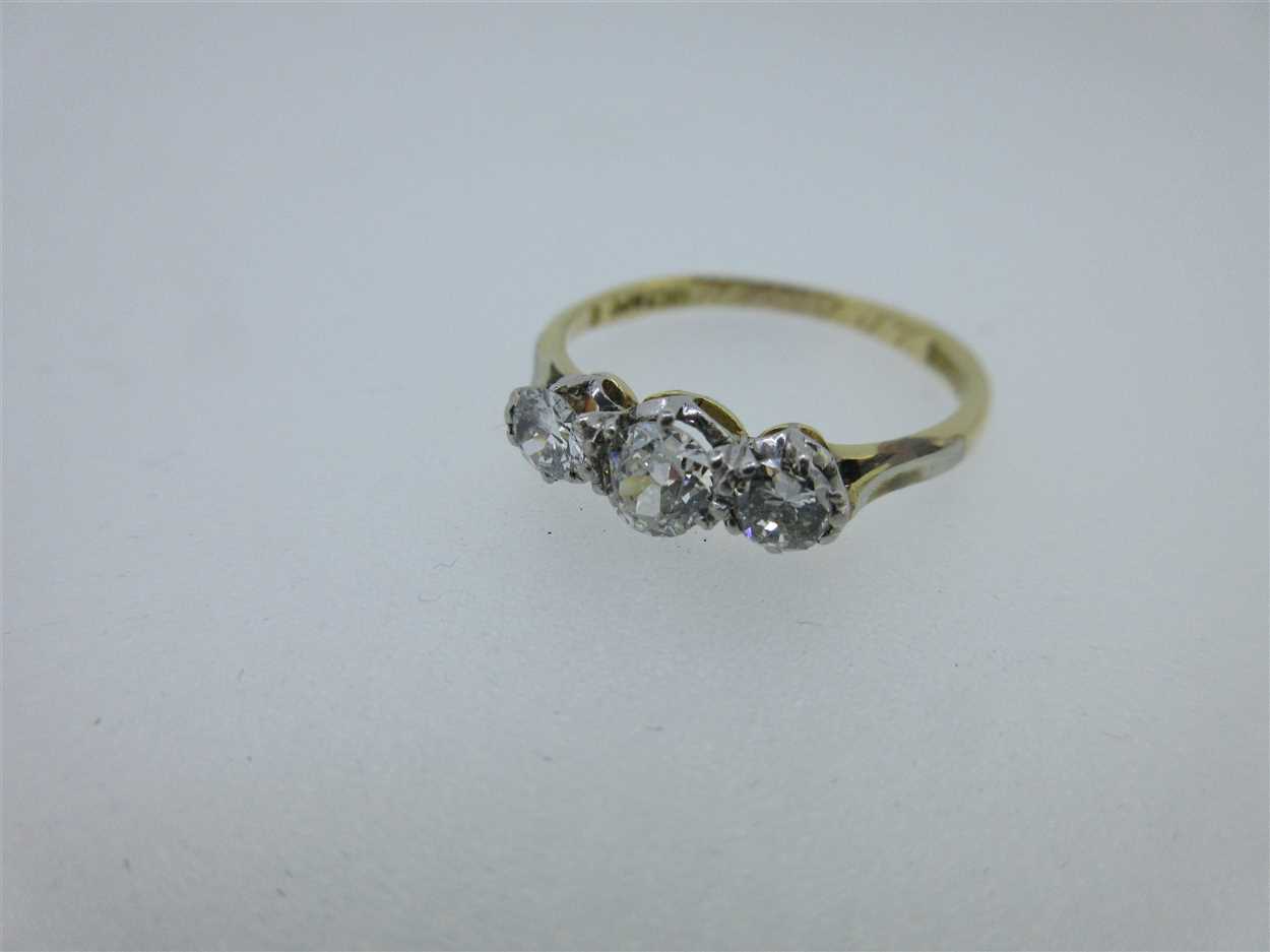 Three diamond or gemset rings testing for 18ct gold, in Cheffins Fine Art