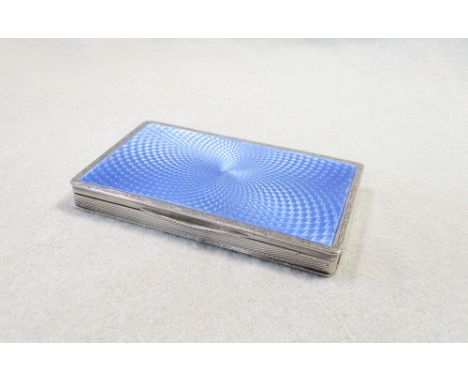 by Henry Clifford Davis, Birmingham 1925, of rectangular form, the piano hinged cover decorated with a swirl of blue guilloch