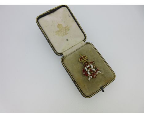the interlaced initials signifying Edward Imperator Rex (Emperor, King), with the E and I in red guilloche enamel, the R in w