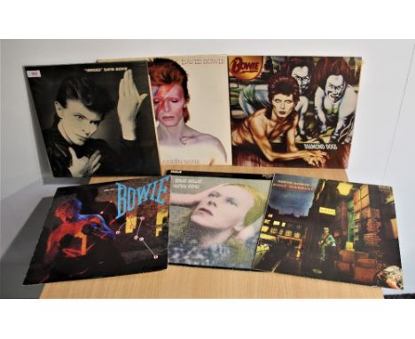 A lot of Seven David Bowie albums with relevant inners - all in good playing condition