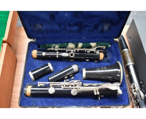 A Bundy (Selmer) resonite clarinet, impressed serial number 1459259, in toughened plastic plush lined case