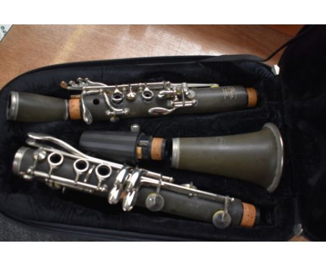 A Paris Debut clarinet, impressed serial number K3127, in back pack style case