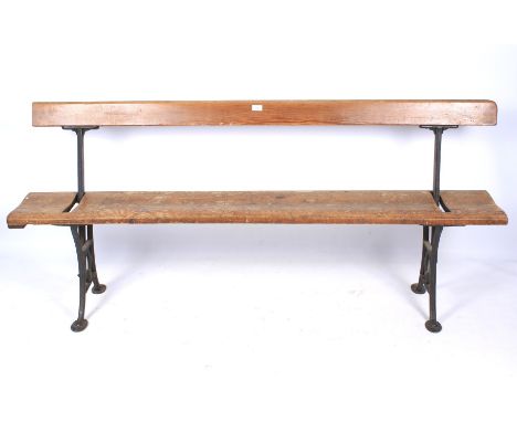 A 19th century iron and pitch pine tram swing back pew/bench. The cast iron supports stamped Wake & Dean London. L173cm x H 8