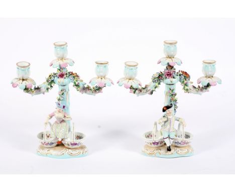 A pair of Continental porcelain late 19th century Meissen-style three-light candelabra. Blue crossed swords and dot marks, ea
