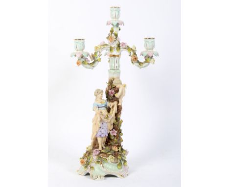 A late 19th century German porcelain four light Meissen-style candelabra. Blue hatch mark, painted and impressed numerals, pr