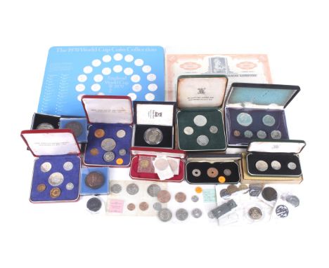 A quantity of world coin sets. Including British Virgin Island, some silver, and a share certificate.