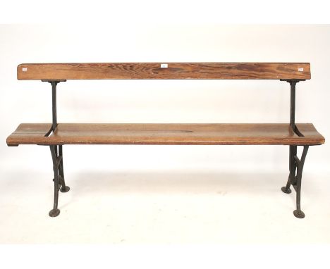 A 19th century iron and pitch pine tram swing back pew/ bench. The cast iron supports inscribed Wake & Dean London, L173cm x 