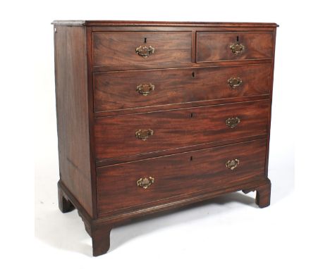 A Georgian mahogany chest of drawers. With two short drawers above three long graduated drawers, with replacement brass swing