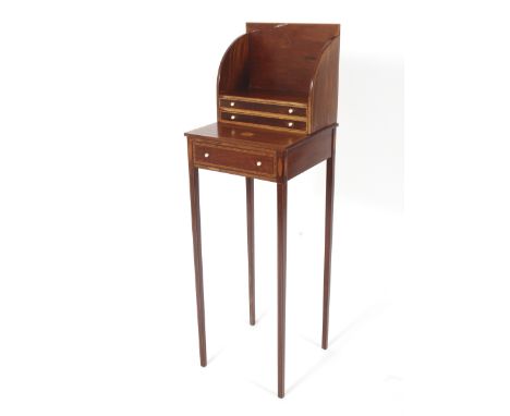 An Edwardian inlaid mahogany miniature desk. With open book shelf above two drawers above a single drawer lower section raise