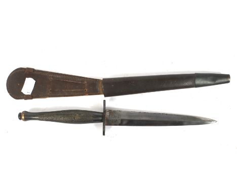 A mid-century Wilkinson sword F S fighting knife. The blade etched Wilkinson sword London, the F S fighting knife, in leather