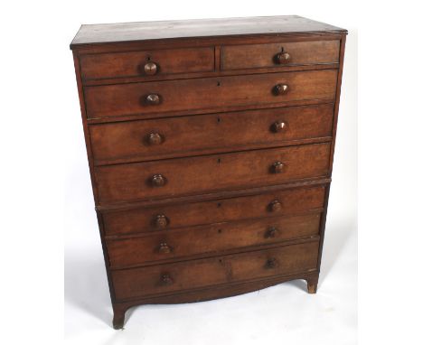A Georgian mahogany chest on chest. The upper section of two short over three graduating long drawers. The base of the gradua