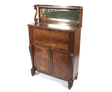 A 19th century mahogany mirror backed chiffonier secretaire. The upper shelf with 3/4 gallery rail supported by carved scroll