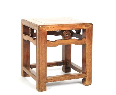 A Chinese hardwood square section stool. With carved scroll and circular apron, on chamfered legs joined by stretchers, 33cm 
