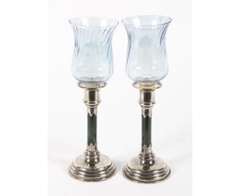 A pair of Edward VII silver and hardstone mounted candlesticks. With removable sconces and fluted glass shades, the green har