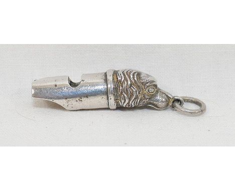 An Edwardian novelty silver dog whistle, Chester 1904, the base of the whistle in the form of a spaniel's head, 5cm long incl