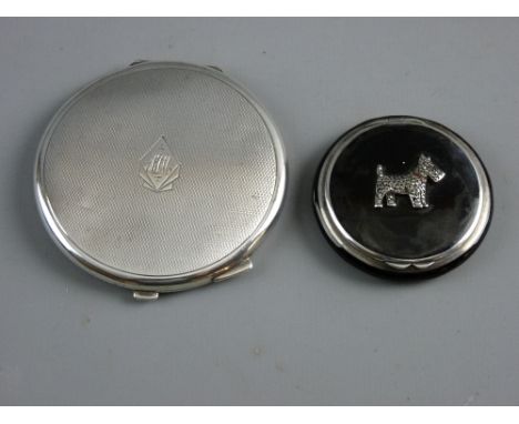 TWO SILVER POWDER COMPACTS, a 5 cms diameter black enamel example set with a marcasite Scottie dog marked '925' with import m