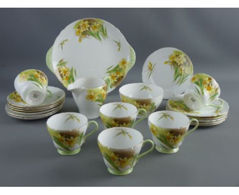 A TWENTY ONE PIECE SHELLEY 'DAFFODIL TIME' BONE CHINA TEASET comprising six cups, saucers and side plates, milk jug, sugar bo