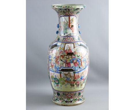 A LARGE ENAMEL DECORATED ON CELADON GROUND CHINESE VASE having framed panels of dramatic scenes containing many figures in tr