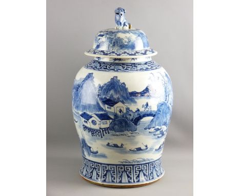 A LARGE BLUE & WHITE CHINESE TEMPLE JAR & COVER, the bulbous body decorated with an all over landscape pattern containing fig