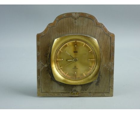 A SILVER MOUNTED BEDSIDE ALARM CLOCK, the gilt brass framed clock with baton markers, the dial marked 'Tecnis', the silver mo