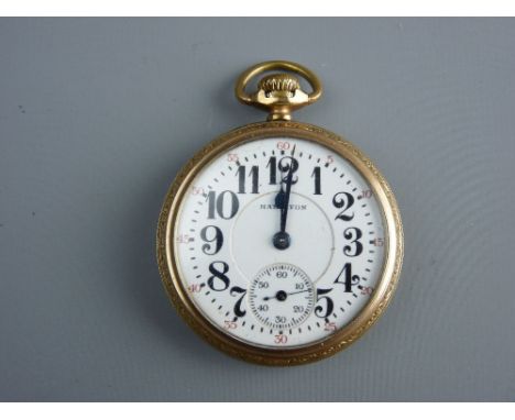 A YELLOW METAL ENCASED, POSSIBLY GOLD BACKED, HAMILTON POCKET WATCH with sweep seconds dial