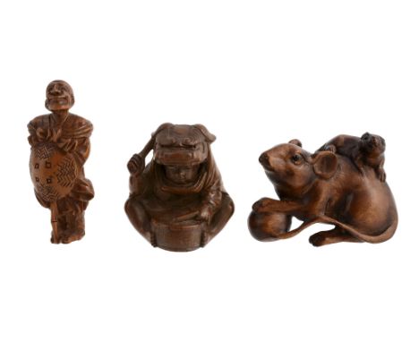 A Wood Netsuke of a Seated Shishimai Dancer  A Wood Netsuke of a Seated Shishimai Dancer  , he sits cross-legged whilst beati