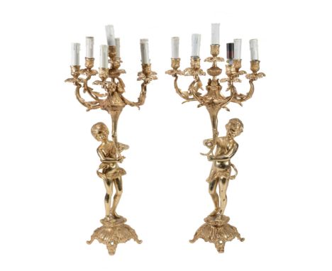 A pair of gilt metal seven light candelabra in Louis XV style  A pair of gilt metal seven light candelabra in Louis XV style,