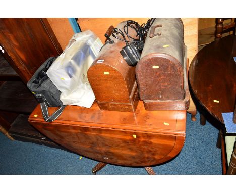 TWO OAK CASED SINGER SEWING MACHINES, another sewing machine, cased Minolta camera and a yew wood drop leaf dining table (5)