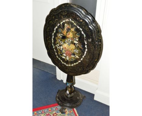 A VICTORIAN PAPIER MACHE TILT TOP TEA TABLE, of a shaped oval form, black lacquered mother of pearl inlay and floral decorati