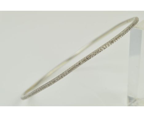 A DIAMOND BANGLE, pave set with single cut diamonds, diamond weight stamped to inner bangle 0.57ct, stamped 375, inner diamet