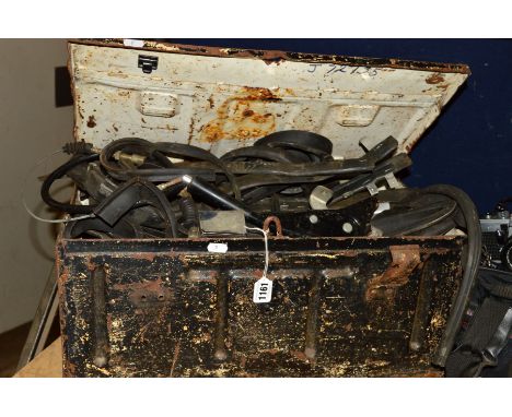 A METAL AMMO CRATE, containing a small collection of vintage car parts