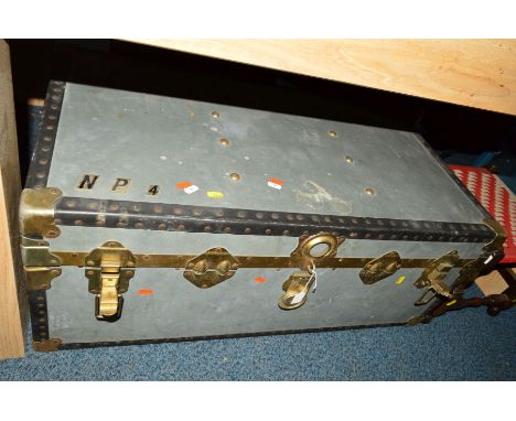 A METAL FRAMED TRAVELLING TRUNK