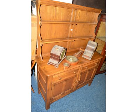 AN ERCOL ASH DRESSER, with two drawers and double cupboard doors, width 122cm x depth 47cm x height 161cm 
