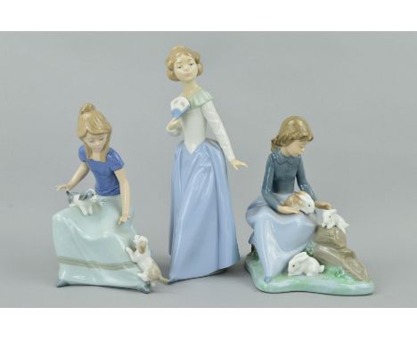 THREE NAO FIGURES, 'My Poppy' No1009 girl with dogs, height 17.5cm, Girl with Rabbits No1026, height 17.5cm and 'Demure' girl