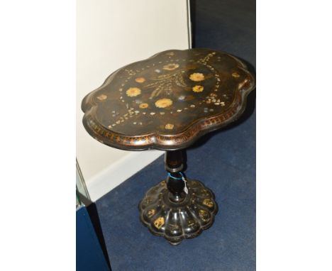 A VICTORIAN PAPIER MACHE TILT TOP TEA TABLE, of an shaped oval form, black lacquered mother of pearl inlay, gilt and floral d