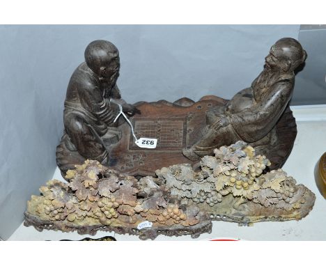 A CHINESE WOOD CARVING, of two men playing board game, length approximately 44cm x height 22.5cm (one man missing foot), toge