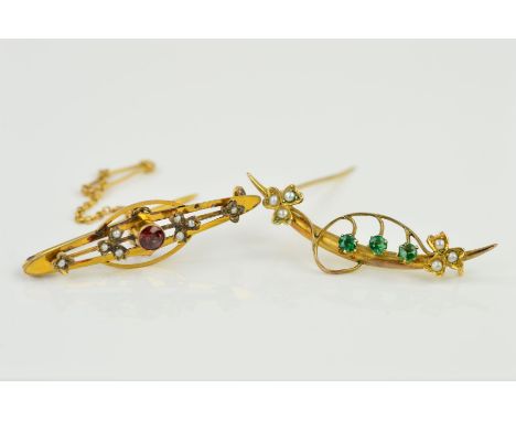 TWO EARLY 20TH CENTURY GOLD BROOCHES, the first designed as a curved tapered bar with applied floral decoration set with thre