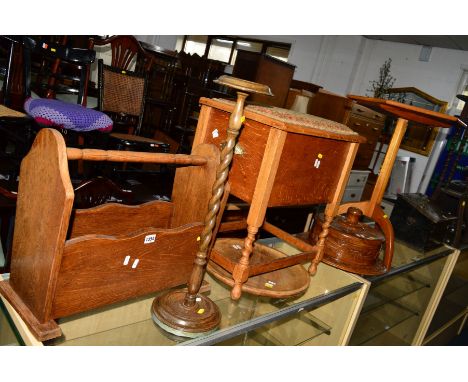 AN OAK BARLEY TWIST SEWING CABINET with a hinged top, a teak hexagonal topped tripod table, an oak magazine rack, carved hard