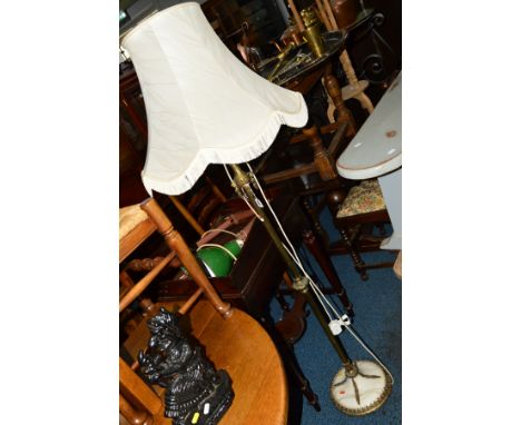 A BRASS AND ONYX STANDARD LAMP with a shade